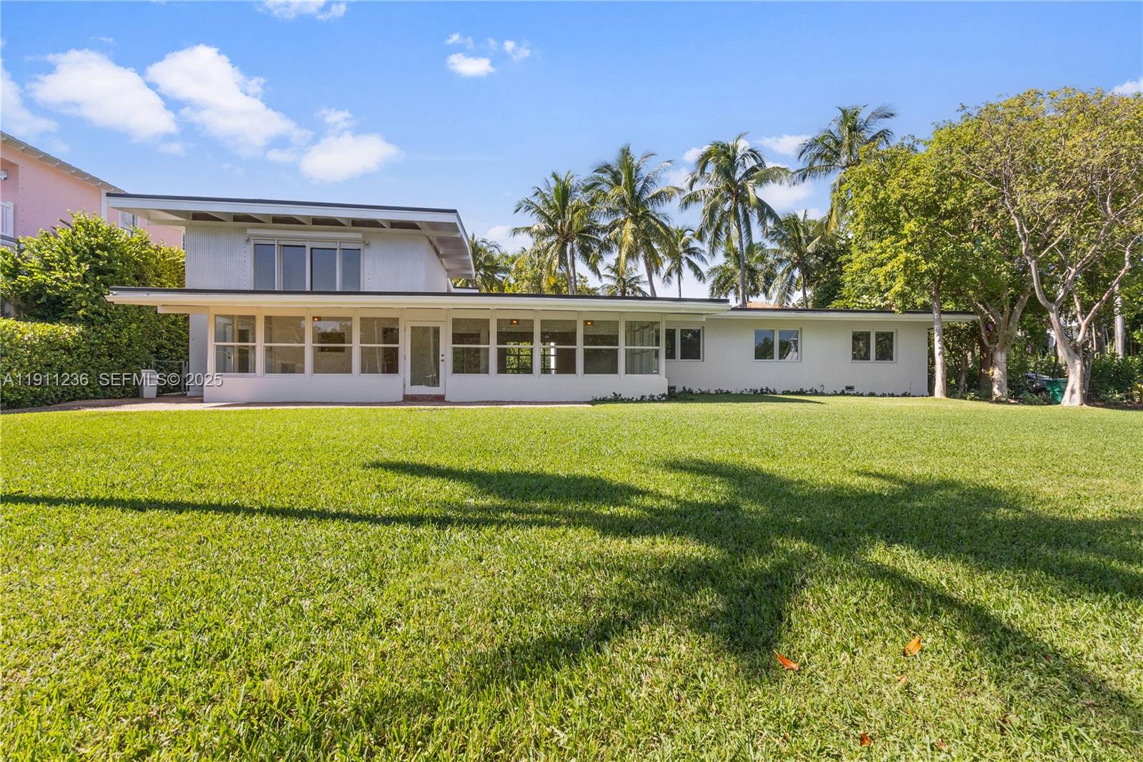 4 Harbor Point Key Biscayne, FL 33149 - Photo 22 of 30 a view of house with yard and outdoor seating