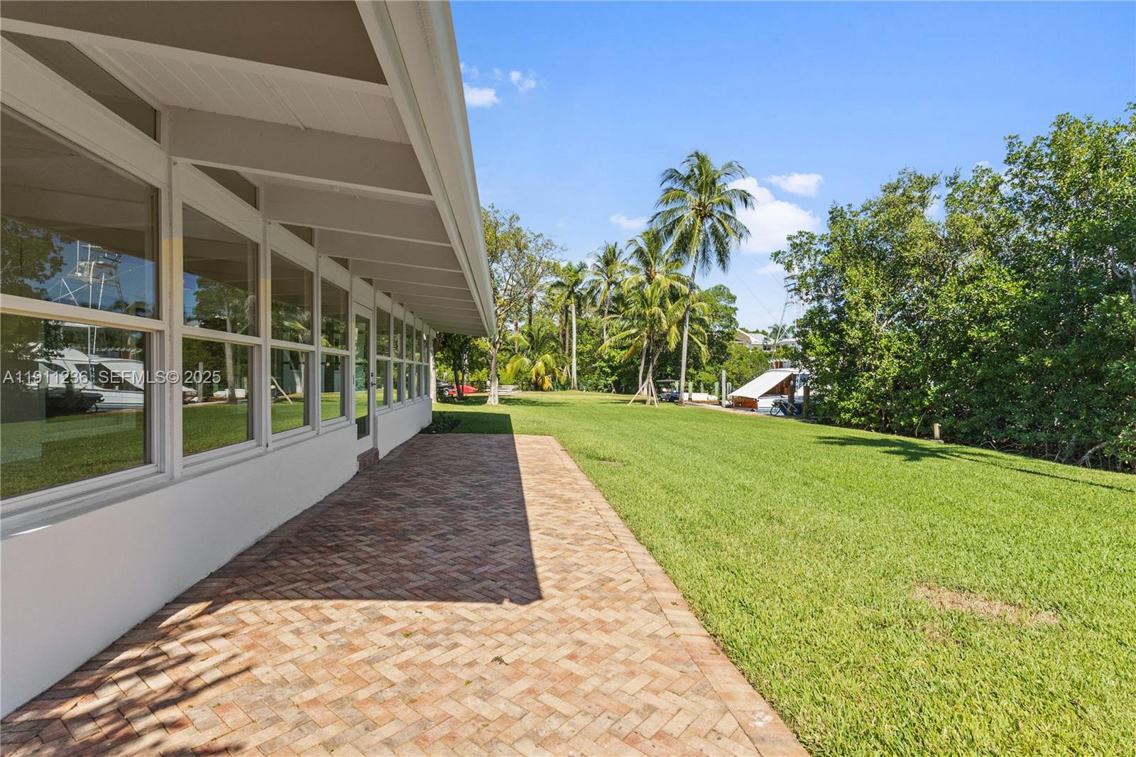 4 Harbor Point Key Biscayne, FL 33149 - Photo 26 of 30 a view of a house with a yard