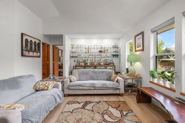a spacious bathroom with a granite countertop sink and a mirror
