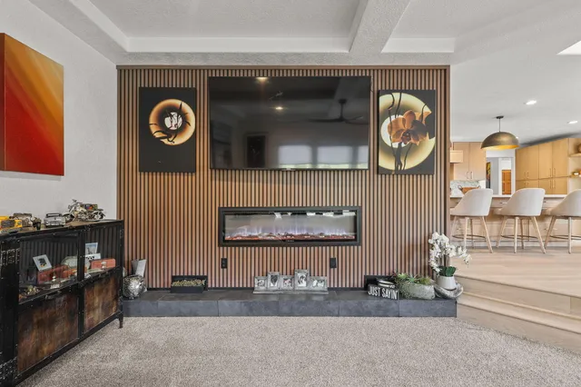 a bathroom with a granite countertop double vanity sink and mirror