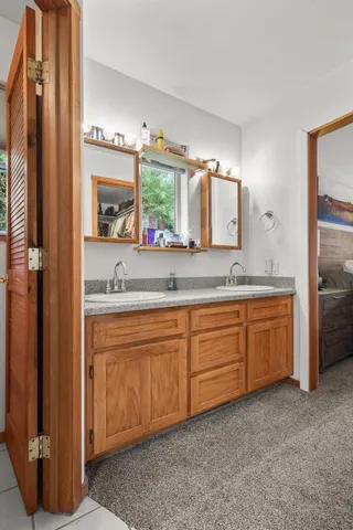 a view of a house with swimming pool and sitting area