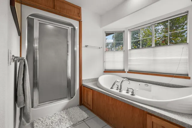 a view of patio with table and chairs potted plants