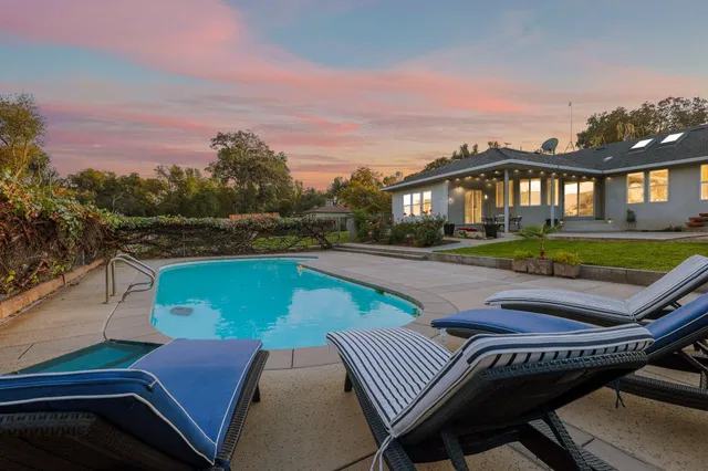 a view of a patio with chair and table