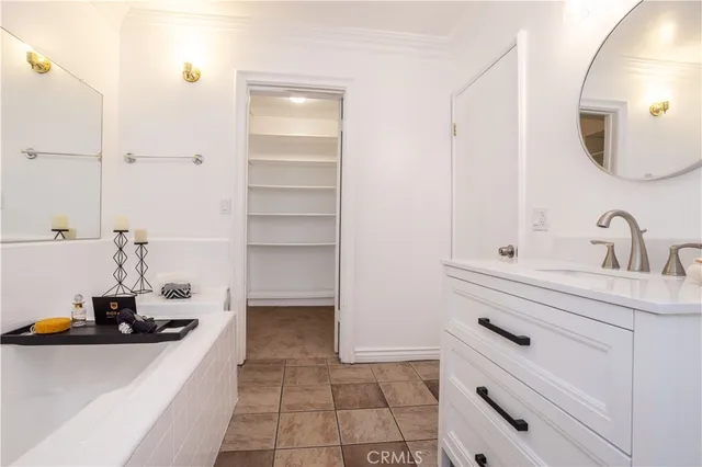 a bathroom with a double vanity sink and mirror
