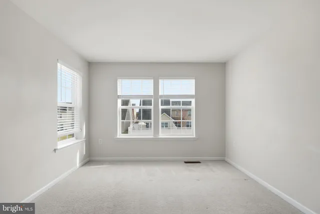 a bathroom with a bathtub sink mirror vanity and toilet