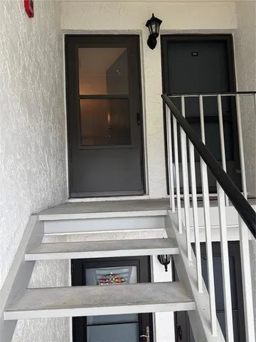 a kitchen with stainless steel appliances granite countertop a stove microwave and sink