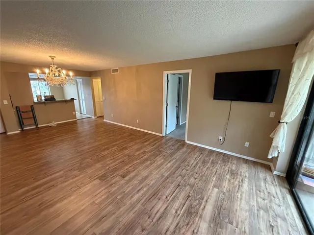 a view of a livingroom with a ceiling fan and window