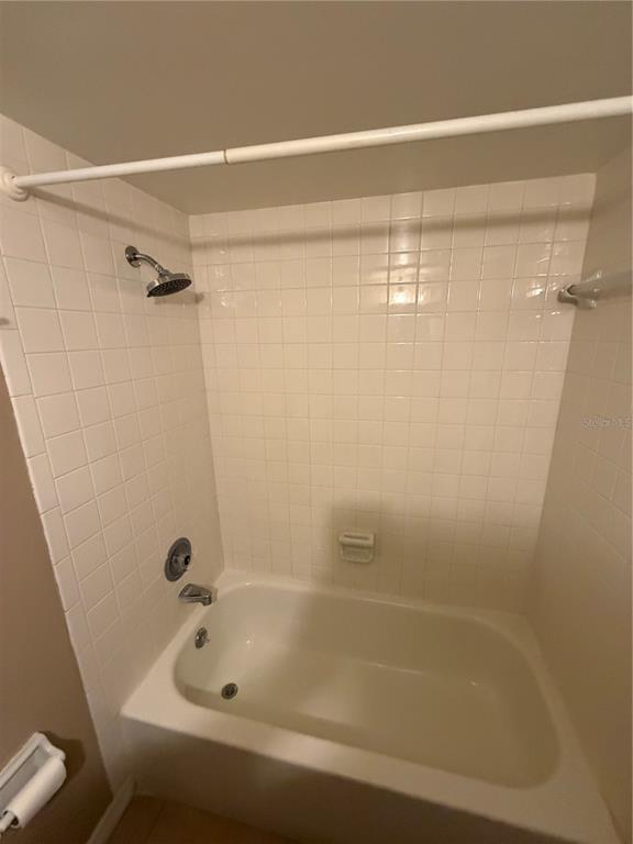 274 Cypress Lane Oldsmar, FL 34677 - Photo 8 of 19 a bathroom with a shower and a bath tub