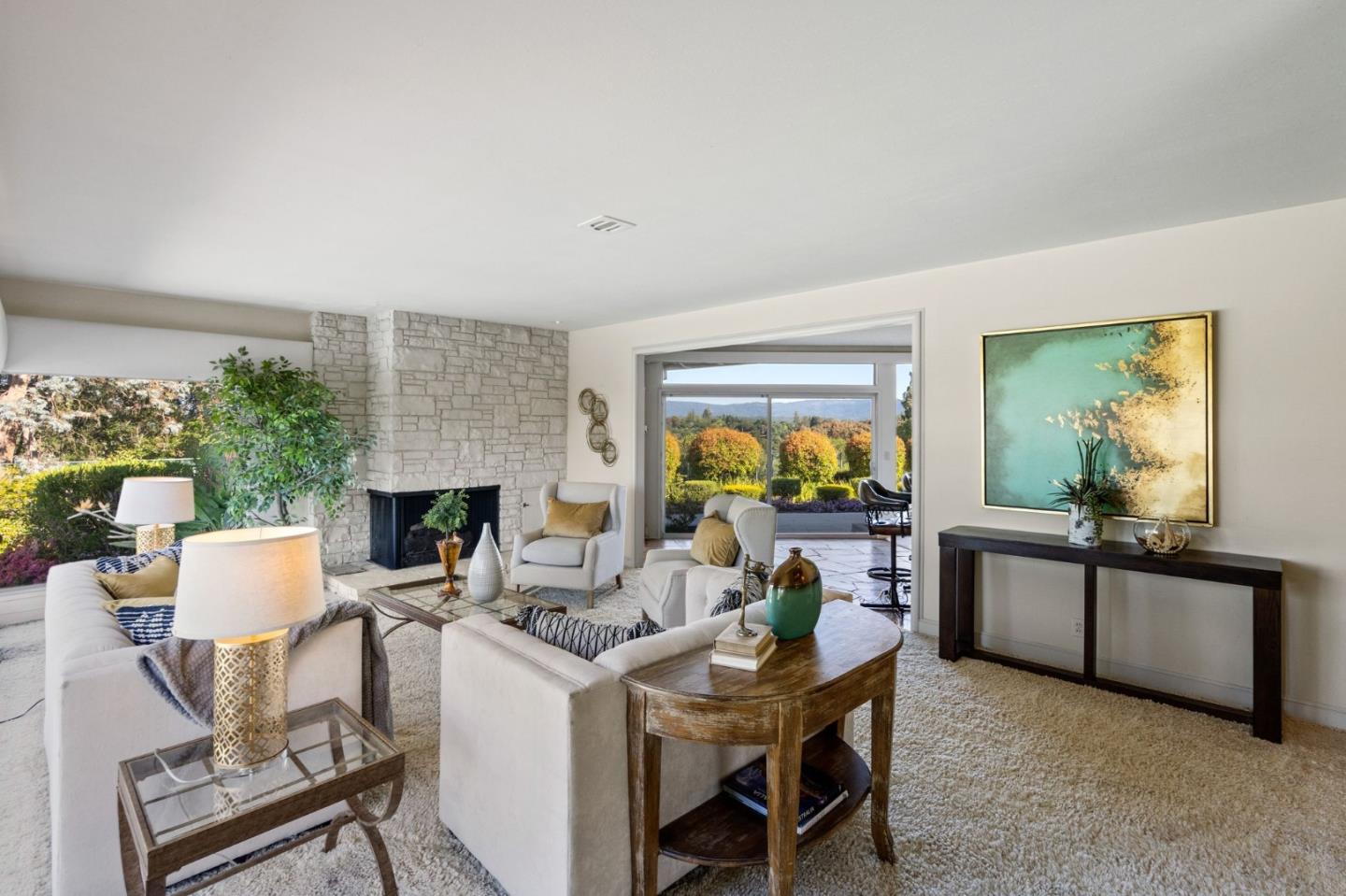 130 Lynn Way Woodside, CA 94062 - Photo 13 of 47 a living room with furniture a fireplace a rug and a window