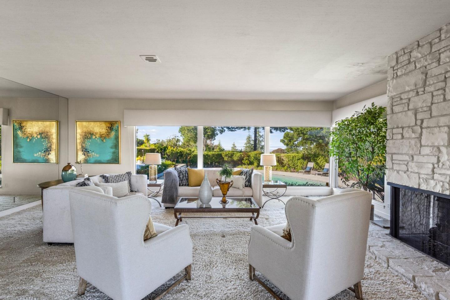 130 Lynn Way Woodside, CA 94062 - Photo 14 of 47 a living room with fireplace furniture and a large window