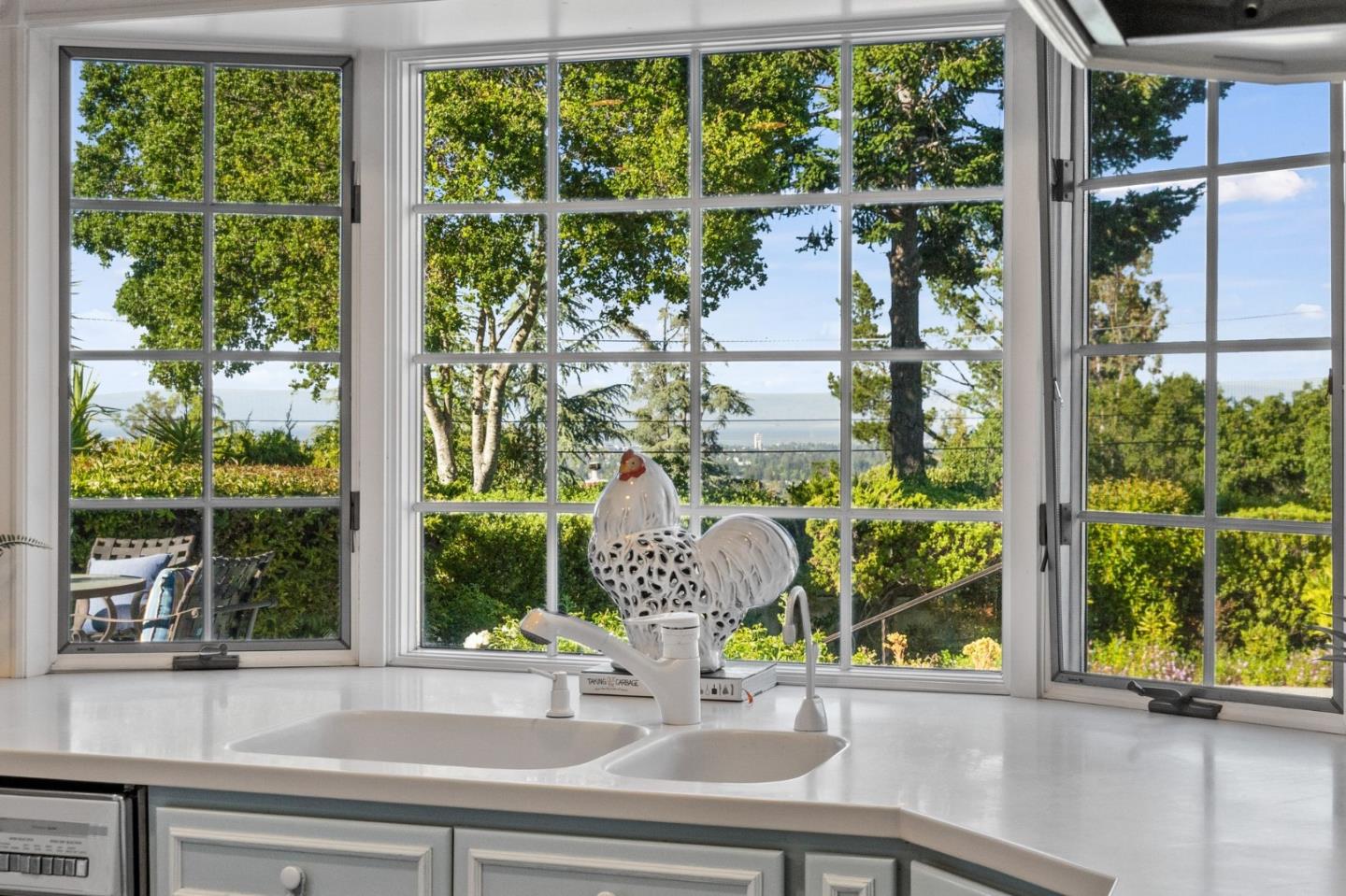 130 Lynn Way Woodside, CA 94062 - Photo 20 of 47 a vase of flowers sitting on a window