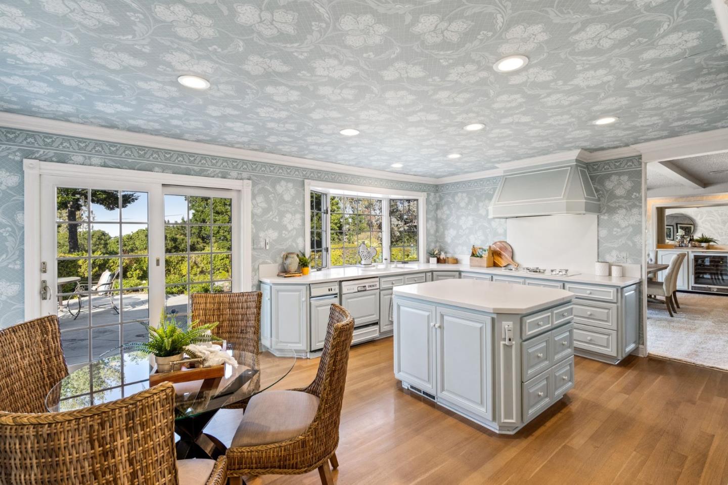 130 Lynn Way Woodside, CA 94062 - Photo 22 of 47 a kitchen that has a lot of cabinets a sink and wooden floor