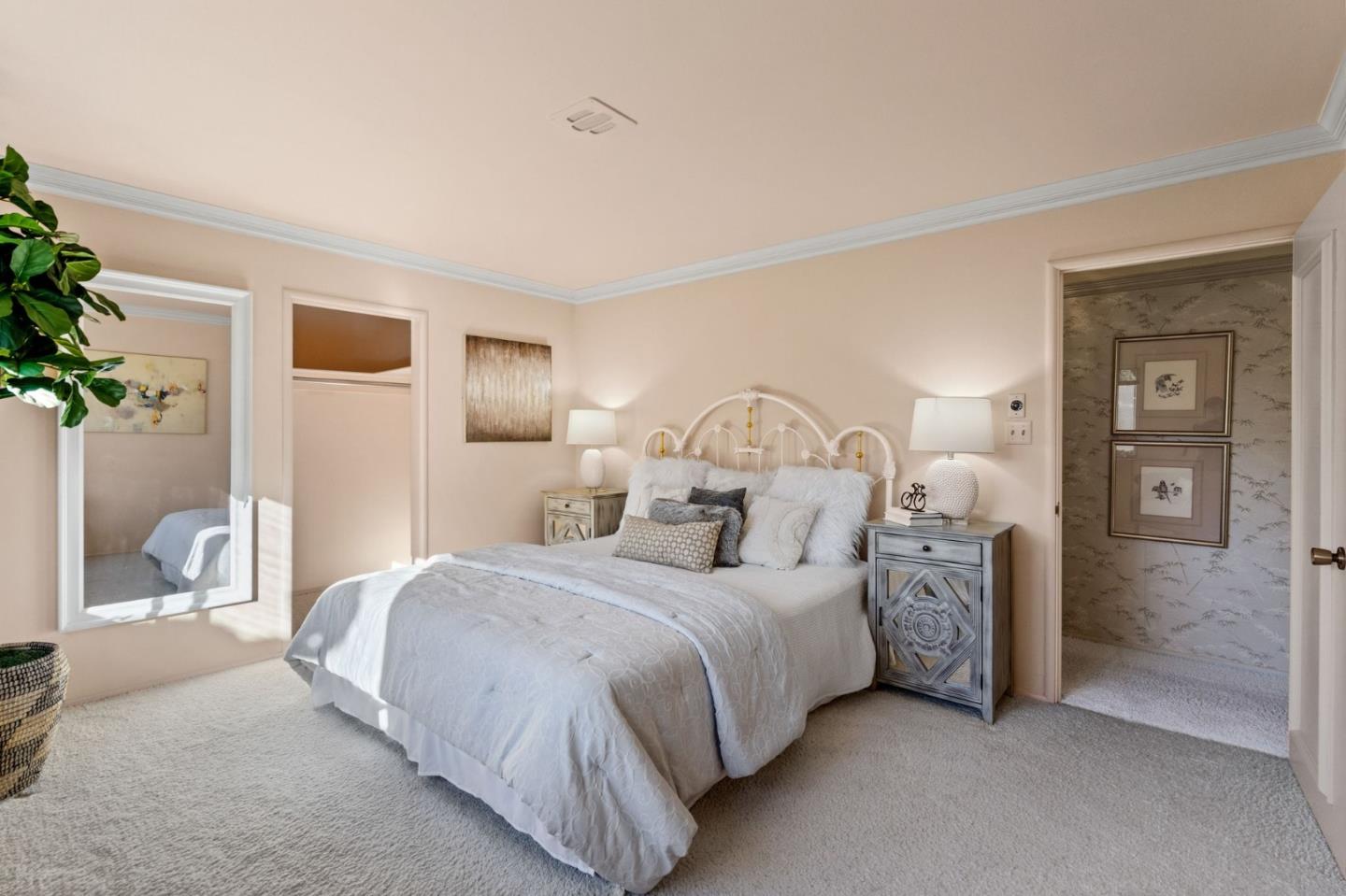 130 Lynn Way Woodside, CA 94062 - Photo 30 of 47 a bedroom with bed and a potted plant