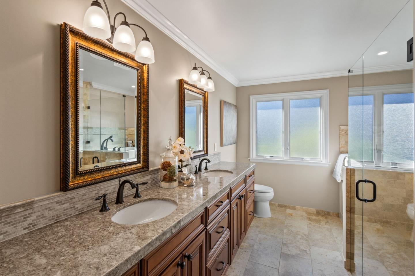 130 Lynn Way Woodside, CA 94062 - Photo 31 of 47 a bathroom with a granite countertop double vanity sink and a mirror