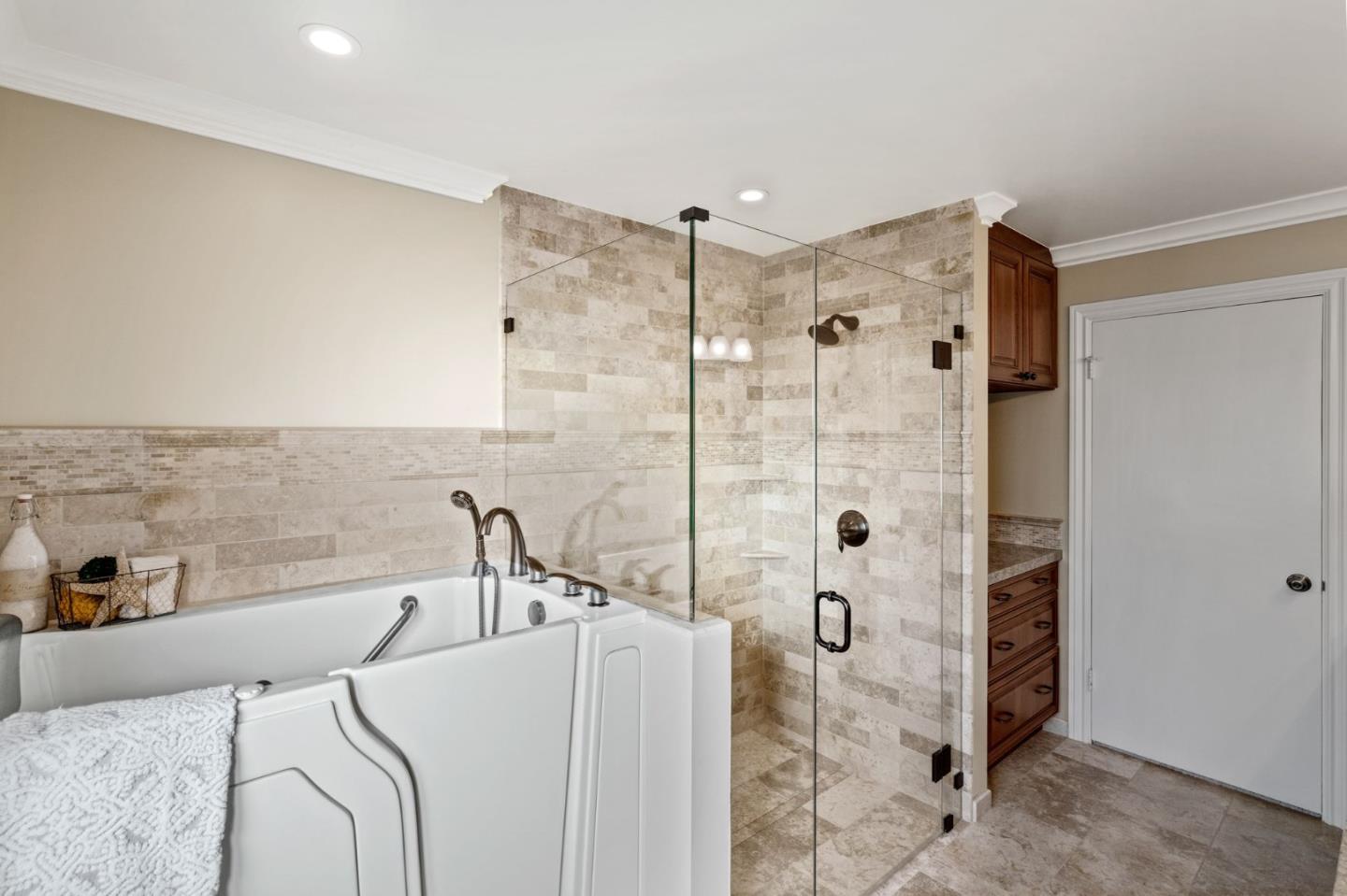 130 Lynn Way Woodside, CA 94062 - Photo 32 of 47 a bathroom with a bathtub and shower