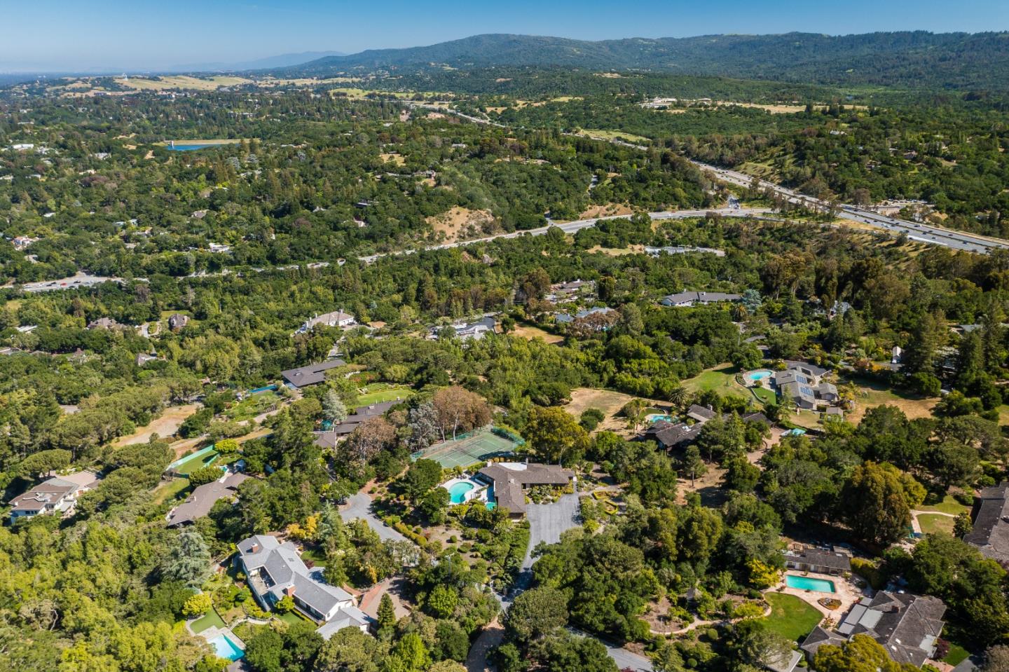 130 Lynn Way Woodside, CA 94062 - Photo 42 of 47 an aerial view of residential houses with outdoor space and trees