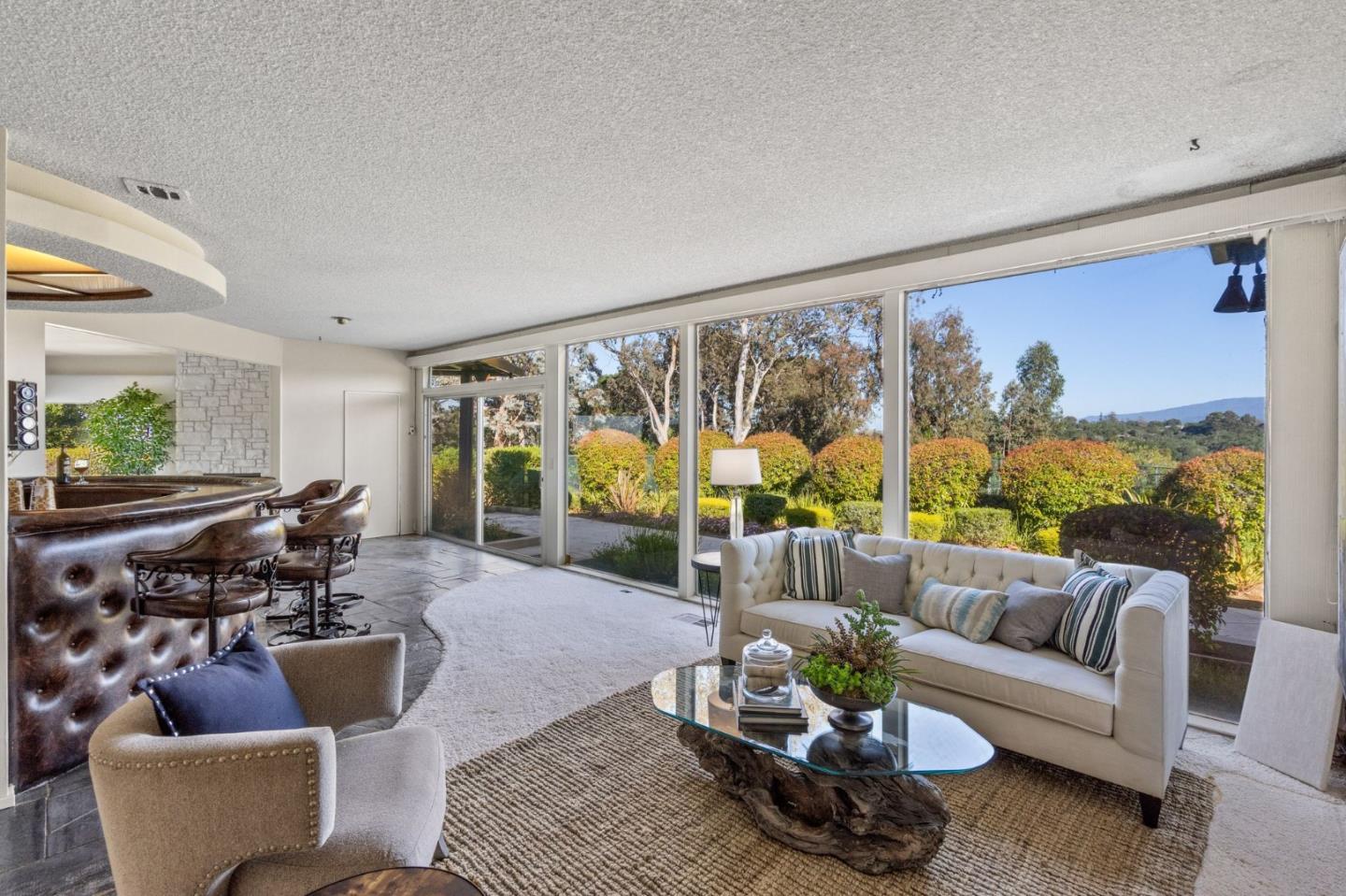 130 Lynn Way Woodside, CA 94062 - Photo 10 of 47 a living room with furniture and a large window