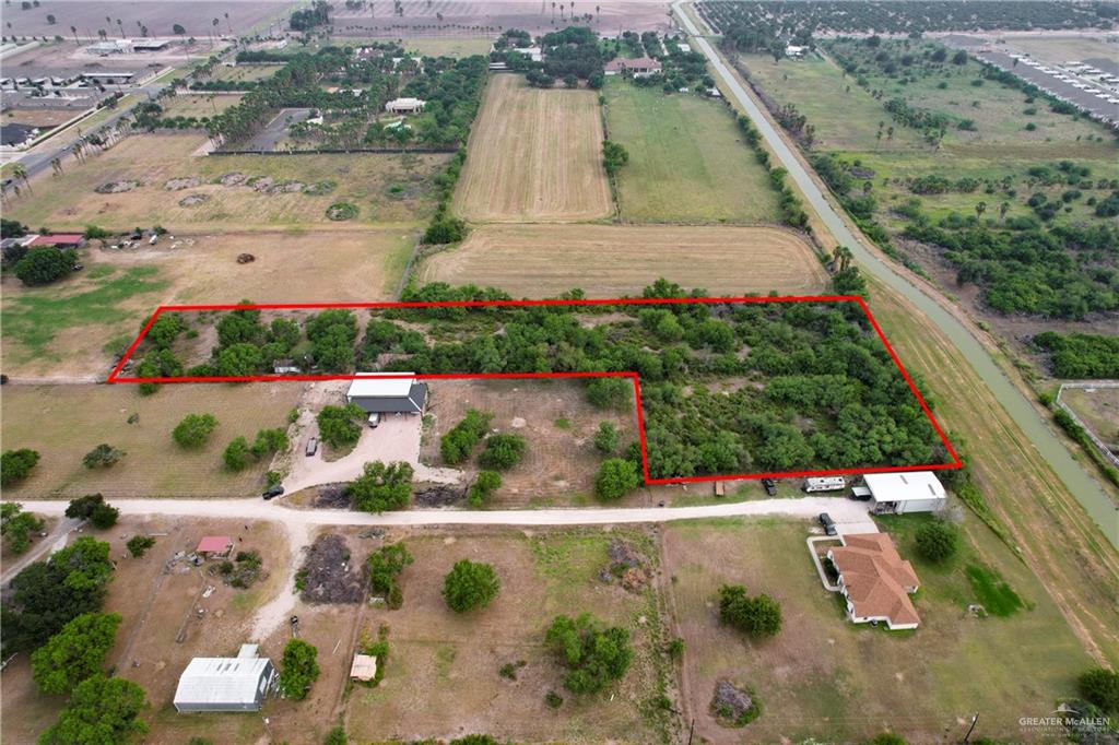 1015 South Shary Road Mission, TX 78573 - Photo 8 of 10 an aerial view of a houses with a yard