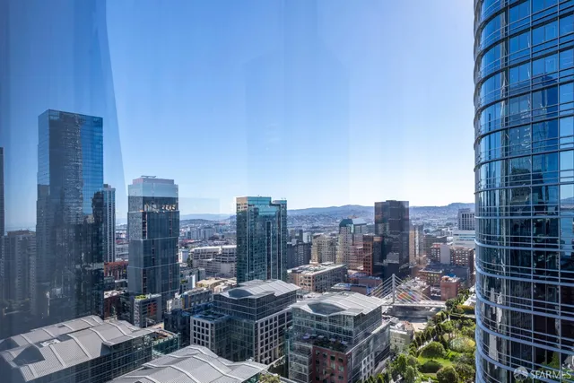 a view of city with tall buildings