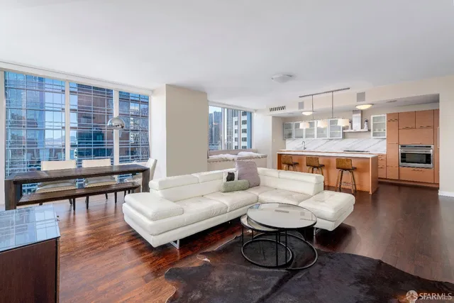 a living room with furniture and a table