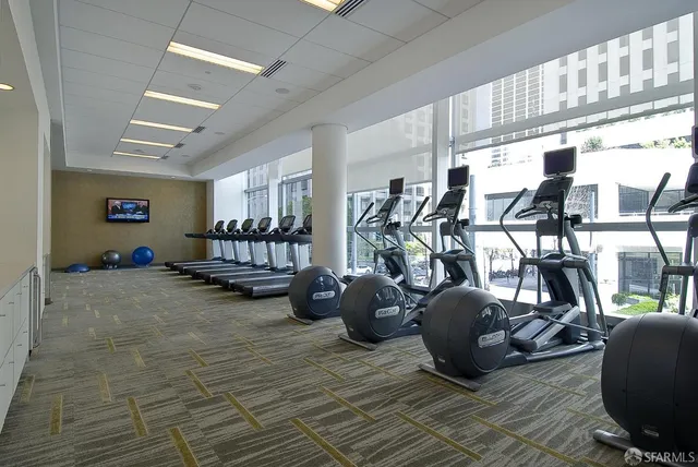 a room with gym equipment and window