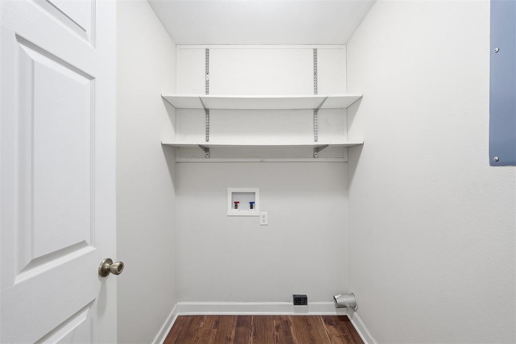710 Erath Street Meridian, TX 76665 - Photo 12 of 26 a view of storage and utility room with racks on the wall