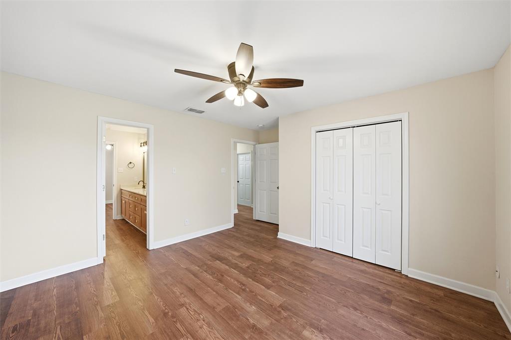 710 Erath Street Meridian, TX 76665 - Photo 14 of 26 a view of empty room with wooden floor