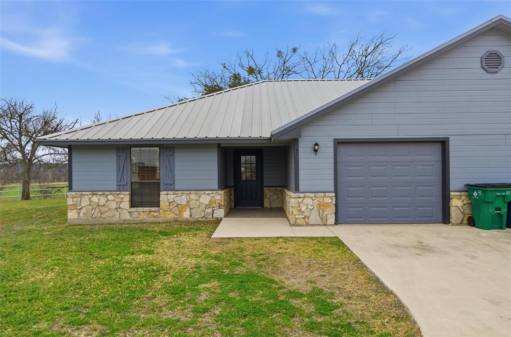 710 Erath Street Meridian, TX 76665 - Photo 4 of 26 a front view of a house with garden