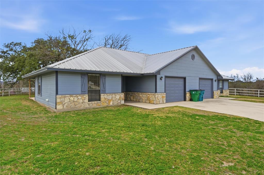 710 Erath Street Meridian, TX 76665 - Photo 5 of 26 a front view of house with yard barbeque and outdoor seating