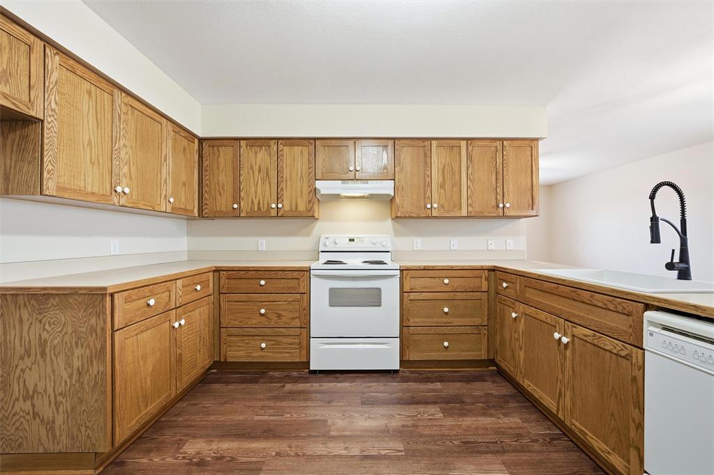710 Erath Street Meridian, TX 76665 - Photo 10 of 26 a kitchen with stainless steel appliances granite countertop a stove and a sink