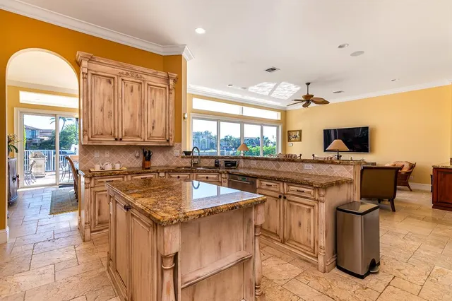 a kitchen with a stove a sink and a refrigerator