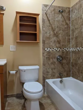 a bathroom with a sink a toilet and bathtub
