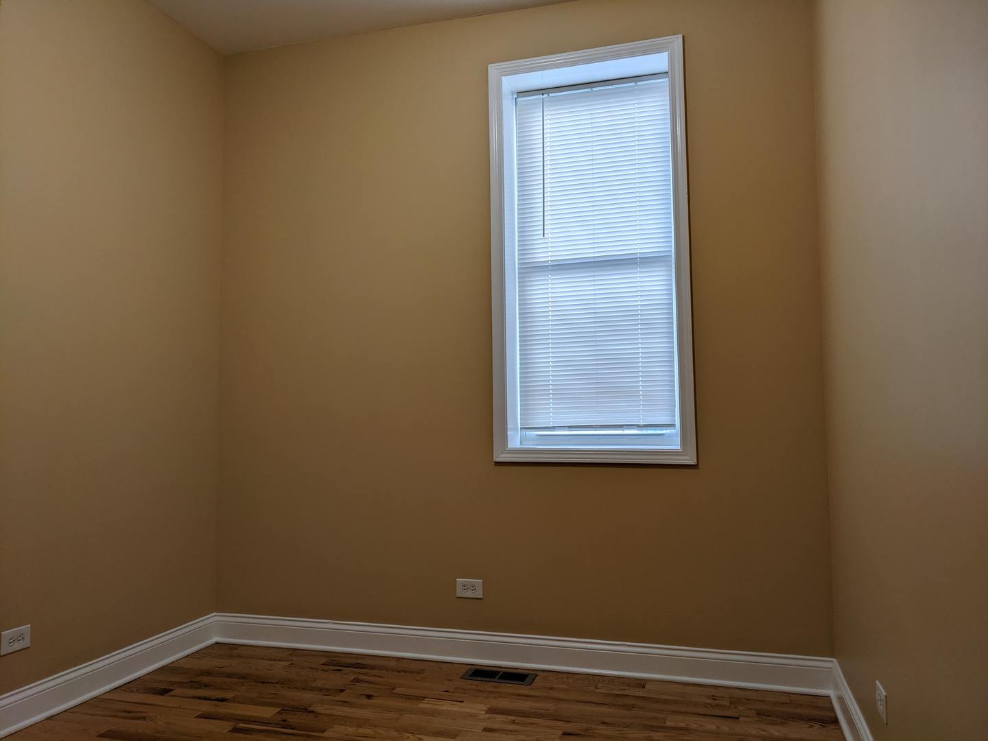 712 South Aberdeen Street, Unit 1A Chicago, IL 60607 - Photo 17 of 28 a view of a small space with wooden floor and a window