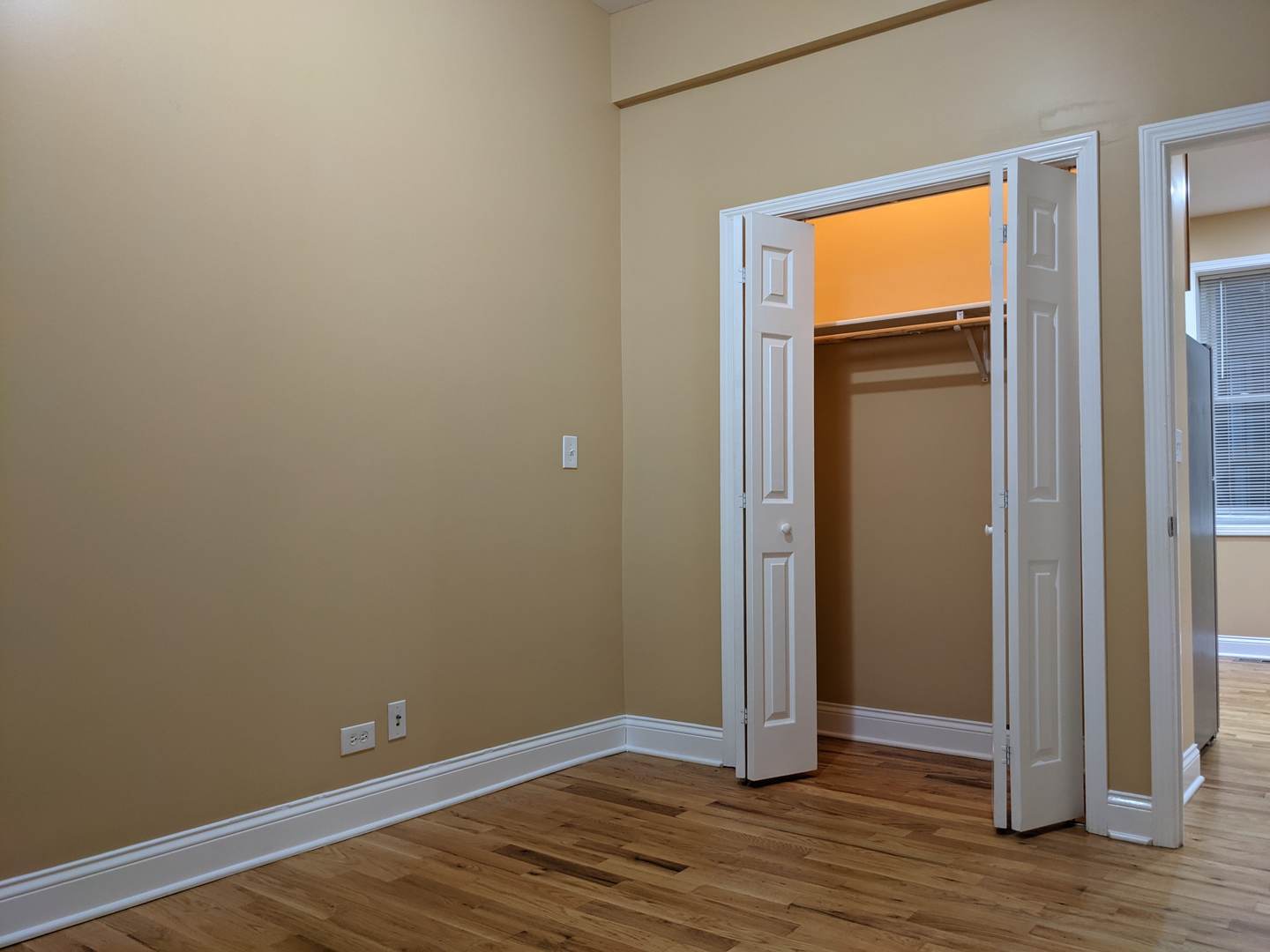 712 South Aberdeen Street, Unit 1A Chicago, IL 60607 - Photo 8 of 28 an empty room with wooden floor and closet