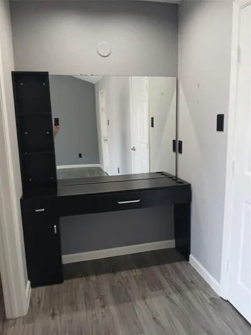 wooden floor with cabinet