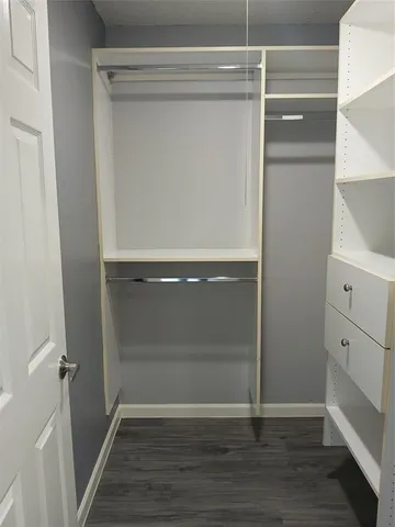 a view of an empty walk in closet