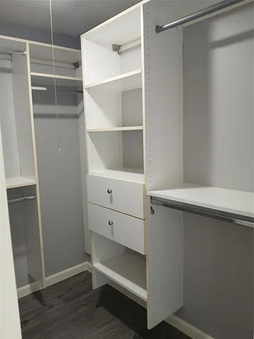 a view of an empty walk in closet