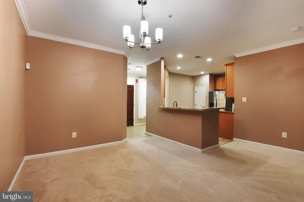 a view of a livingroom with a kitchen