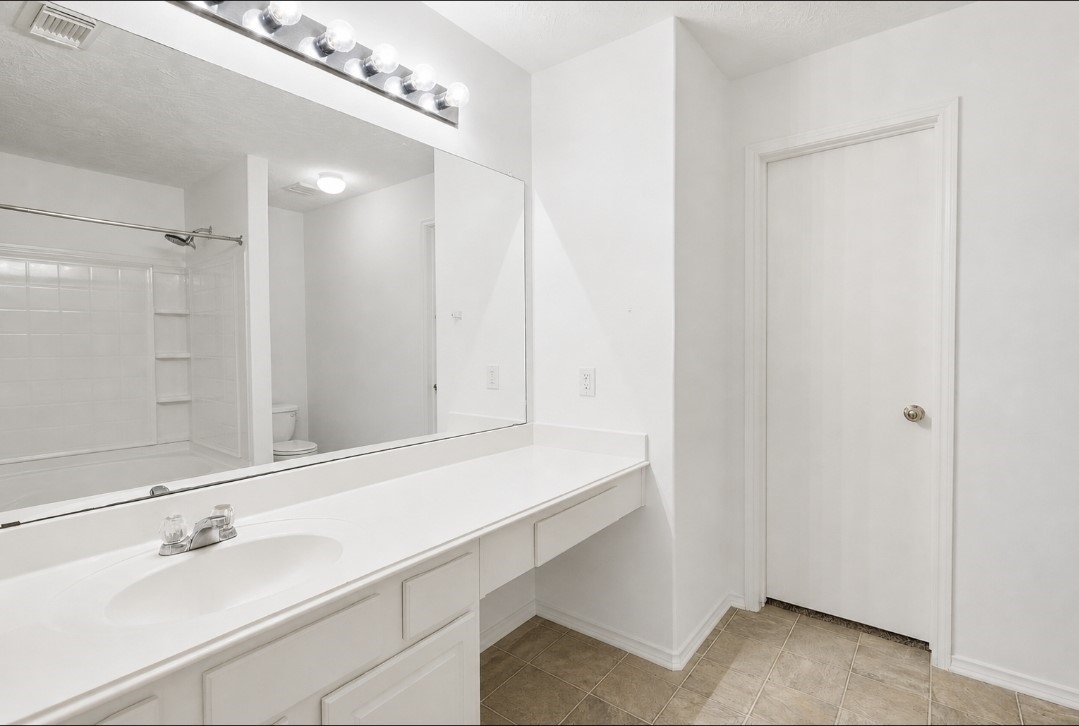11430 Moonlight Ridge Drive Humble, TX 77396 - Photo 11 of 15 a bathroom with a sink and a mirror