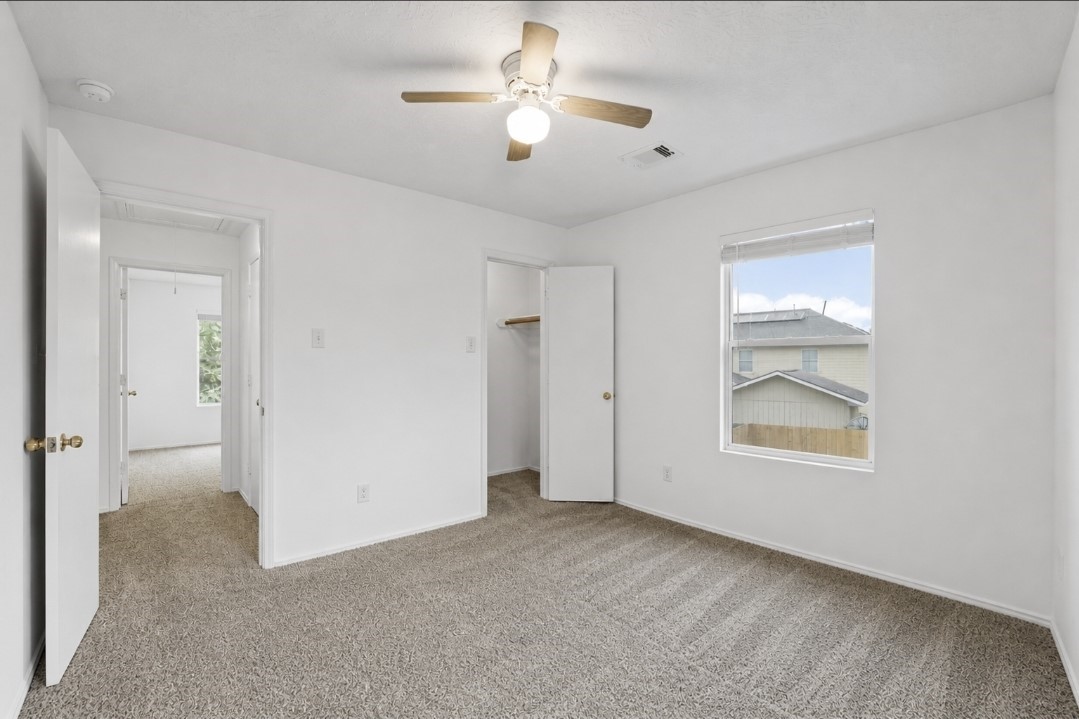 11430 Moonlight Ridge Drive Humble, TX 77396 - Photo 13 of 15 a view of an empty room with a window