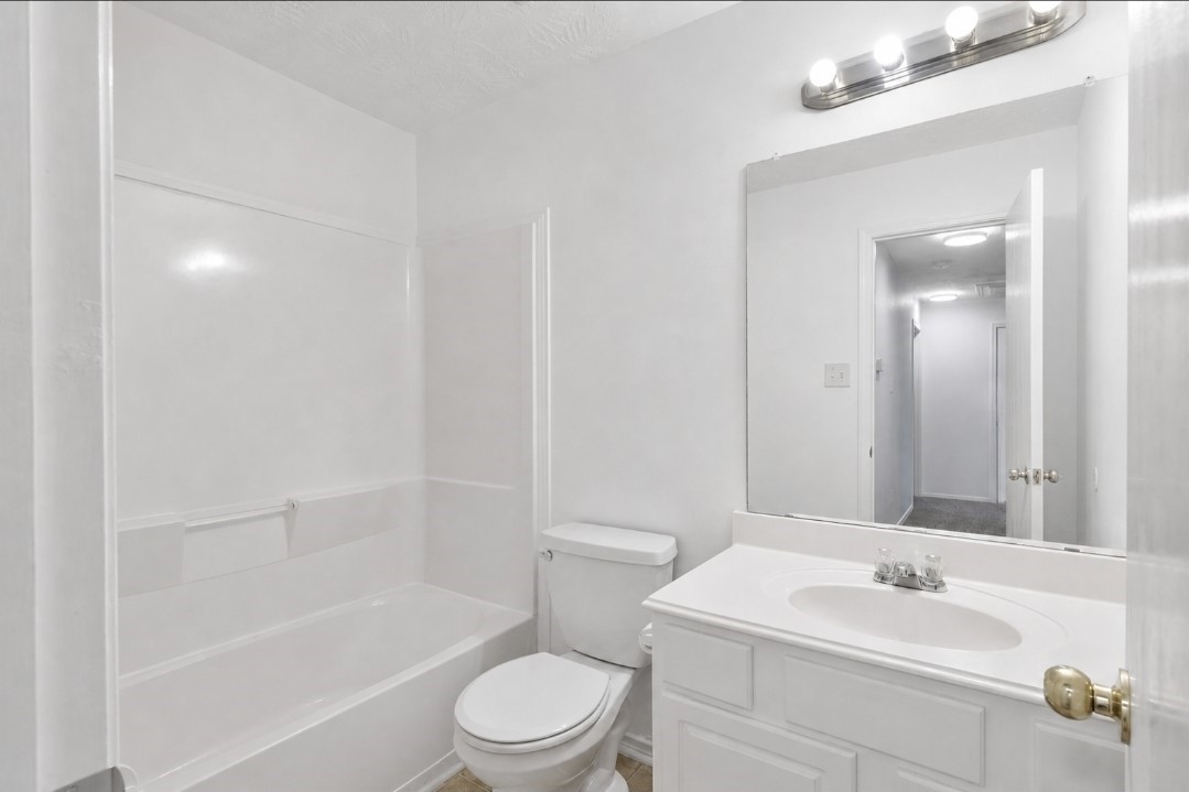 11430 Moonlight Ridge Drive Humble, TX 77396 - Photo 14 of 15 a bathroom with a sink a toilet and shower