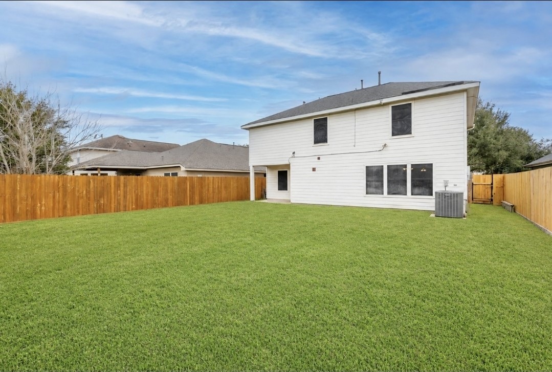 11430 Moonlight Ridge Drive Humble, TX 77396 - Photo 3 of 15 a front view of a house with yard and tree s