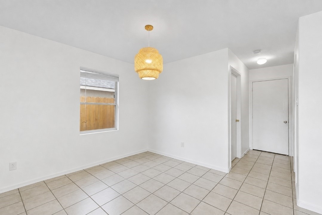 11430 Moonlight Ridge Drive Humble, TX 77396 - Photo 8 of 15 a view of a room with wooden floor and window