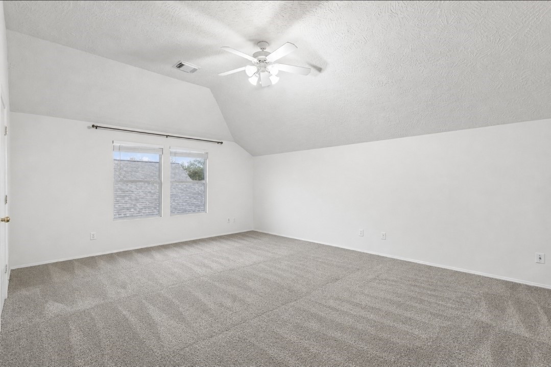 11430 Moonlight Ridge Drive Humble, TX 77396 - Photo 9 of 15 an empty room with windows and fan