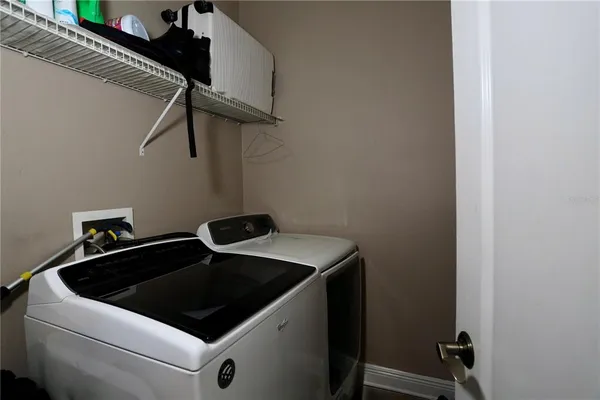 a utility room with dryer and washer