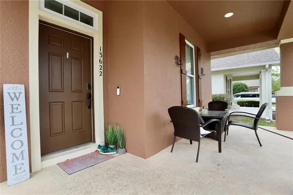 a view of a livingroom with furniture and a window