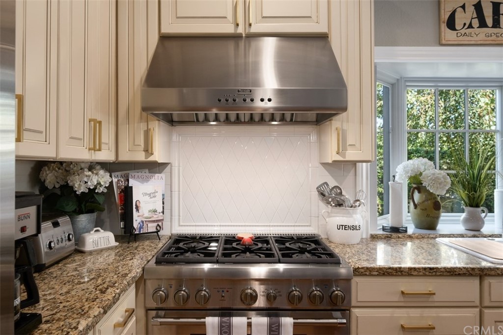 2933 Estancia San Clemente, CA 92673 - Photo 20 of 59 a kitchen with stainless steel appliances granite countertop a stove and a sink
