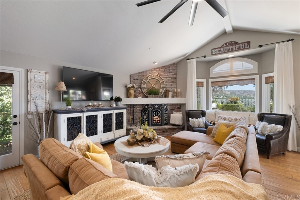 2933 Estancia San Clemente, CA 92673 - Photo 22 of 59 a living room with furniture fireplace and a large window