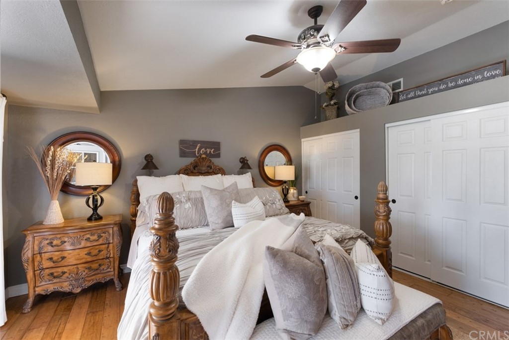 2933 Estancia San Clemente, CA 92673 - Photo 28 of 59 a bedroom with a bed and a chandelier