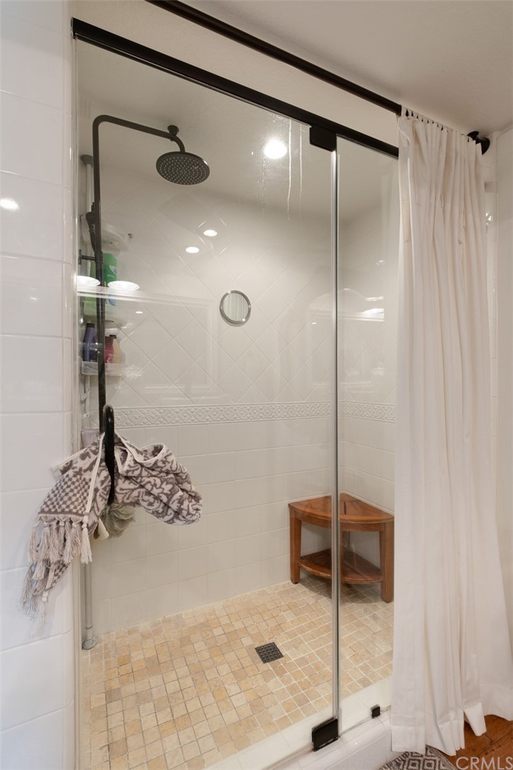 2933 Estancia San Clemente, CA 92673 - Photo 30 of 59 a bathroom with a shower and a glass door